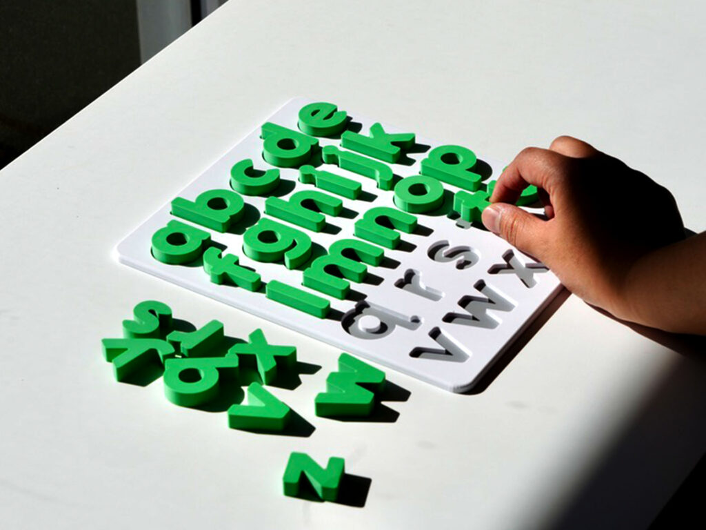 Grass green lowercase alphabet puzzle for preschoolers – educational toy for early literacy and letter recognition.