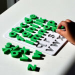 Grass green lowercase alphabet puzzle for preschoolers – educational toy for early literacy and letter recognition.