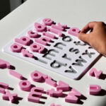 Sakura pink lowercase alphabet puzzle for preschoolers – educational toy for early literacy and letter recognition.