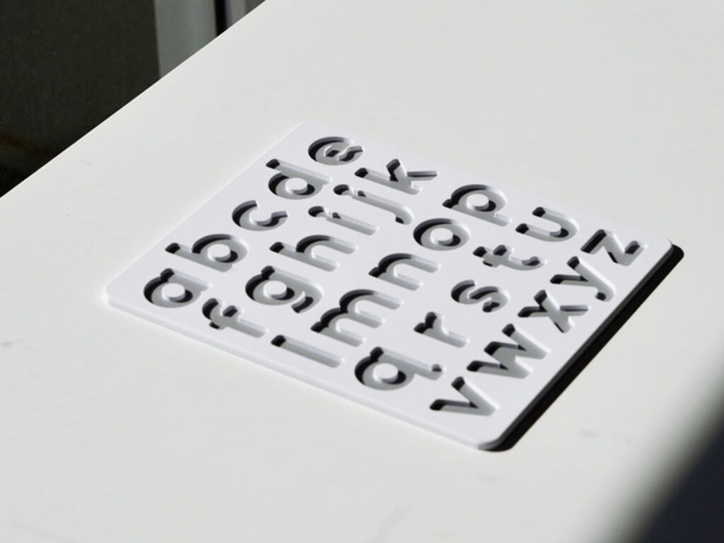 White and grey lowercase alphabet puzzle for preschoolers – educational toy for early literacy and letter recognition.