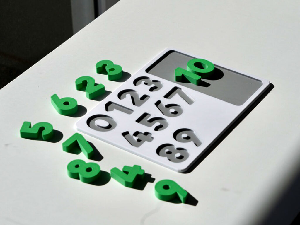 Number puzzle pieces scattered – hands-on counting toy promoting number recognition and early math skills.