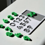 Number puzzle pieces scattered – hands-on counting toy promoting number recognition and early math skills.