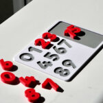 Number puzzle pieces scattered – hands-on counting toy promoting number recognition and early math skills.