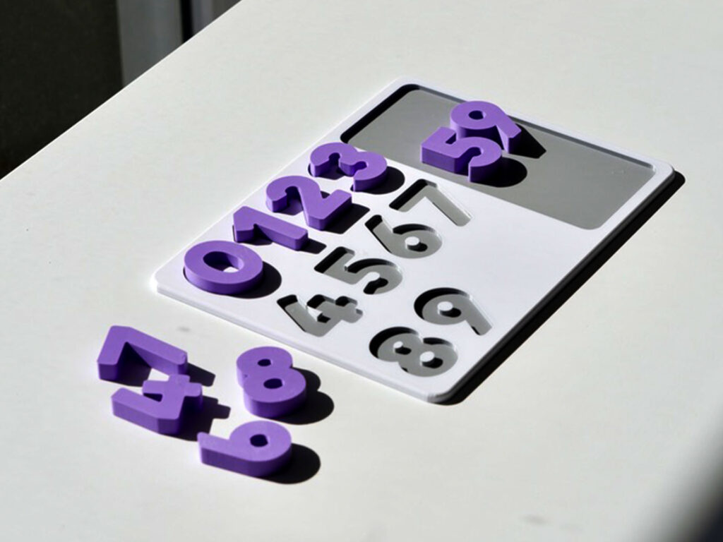 Number puzzle pieces scattered – hands-on counting toy promoting number recognition and early math skills.