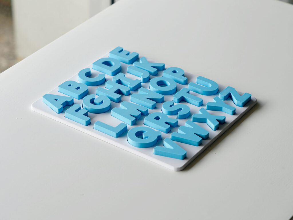 Completed uppercase alphabet puzzle – Australian-made educational toy for preschool letter recognition and phonics practice.