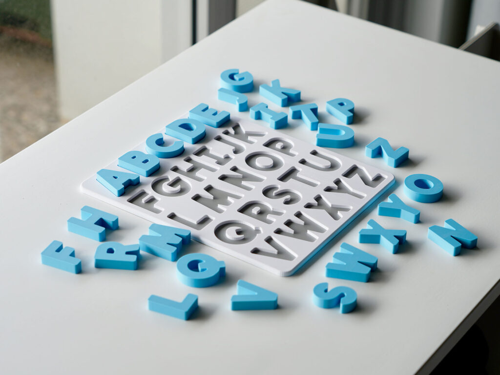 Uppercase alphabet puzzle with scattered letters – hands-on educational toy for letter recognition and early literacy skills.