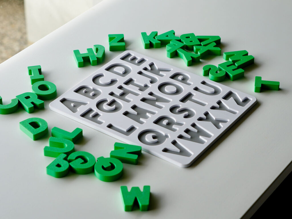 Uppercase alphabet puzzle with scattered letters – hands-on educational toy for letter recognition and early literacy skills.
