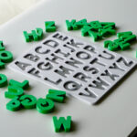 Uppercase alphabet puzzle with scattered letters – hands-on educational toy for letter recognition and early literacy skills.