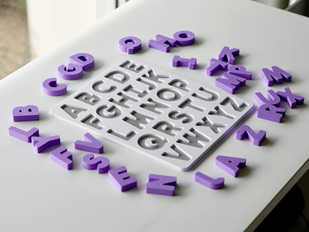 Uppercase alphabet puzzle with scattered letters – hands-on educational toy for letter recognition and early literacy skills.