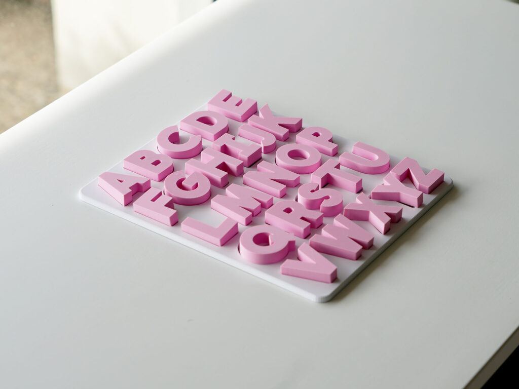 Completed uppercase alphabet puzzle – Australian-made educational toy for preschool letter recognition and phonics practice.