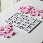 Uppercase alphabet puzzle with scattered letters – hands-on educational toy for letter recognition and early literacy skills.
