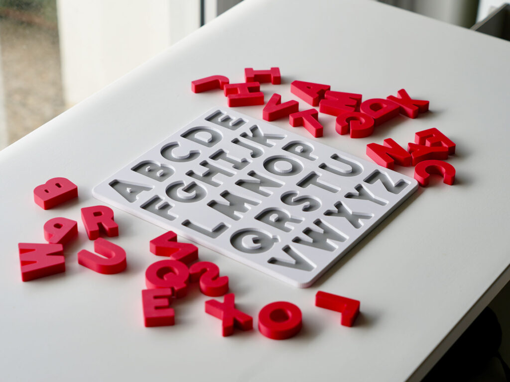 Uppercase alphabet puzzle with scattered letters – hands-on educational toy for letter recognition and early literacy skills.