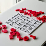 Uppercase alphabet puzzle with scattered letters – hands-on educational toy for letter recognition and early literacy skills.